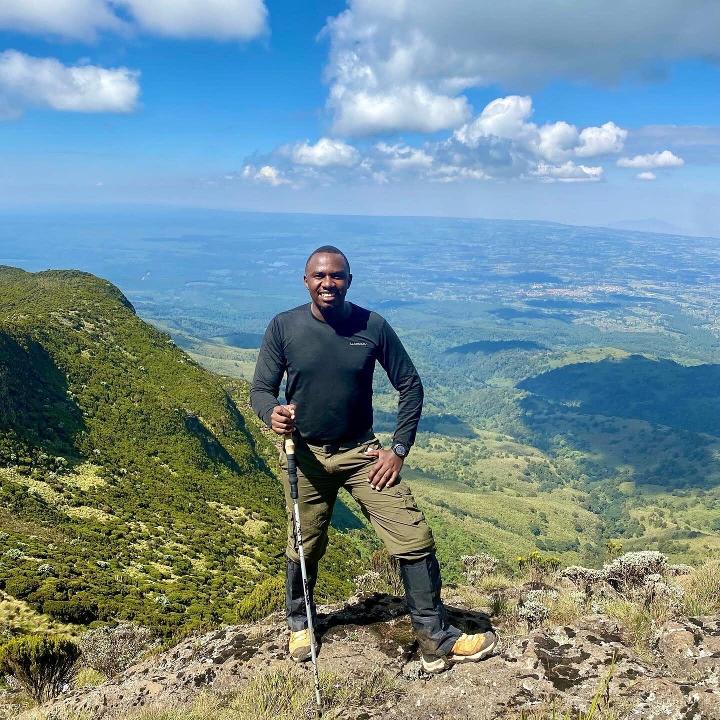 Hiker showing off quick-drying hiking clothes - Mount Kenya Gear Checklisy